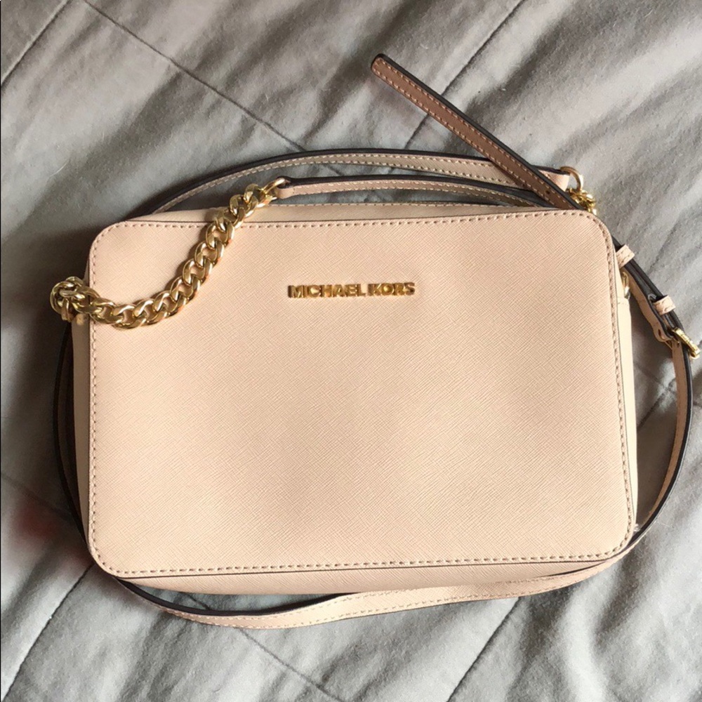 Pale pink Michael Kors crossbody purse